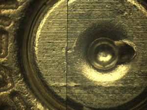 Close-up view of matching breechface marks on a fired cartridge case