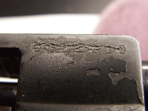 Close up of obliterated serial number